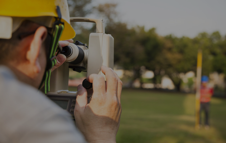 Surveyor resolving residential property line dispute